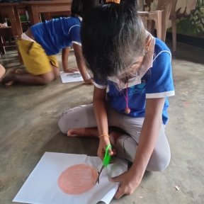 Children cutting and sticking